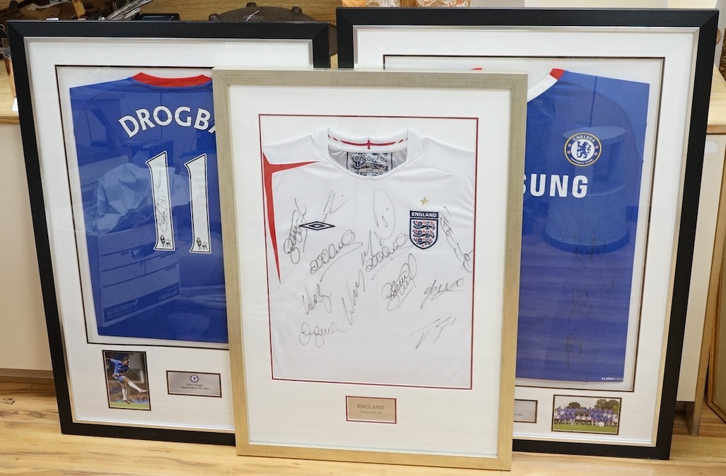 Three signed football shirts, to include England World Cup 2006 and Didier Drogba signed replica CFC shirt, framed. Condition - good